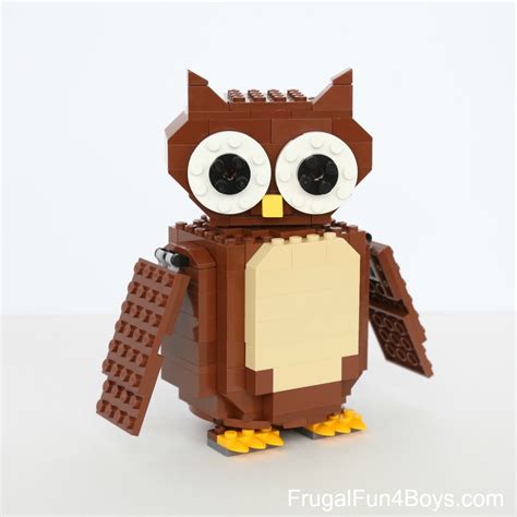 99 and comes with all the pieces to build a brown owl sitting next to orange pumpkins. . Lego owl